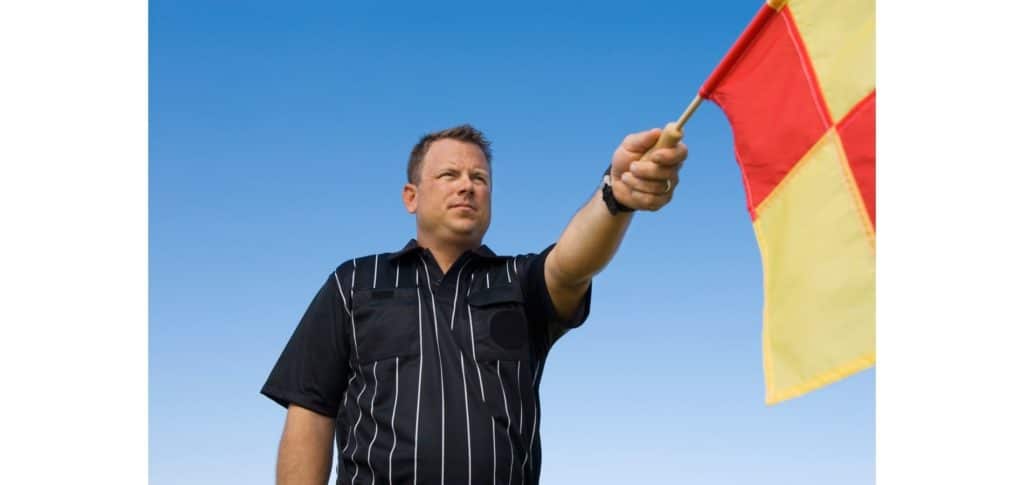 why are linesman flags different colours - identification purposes