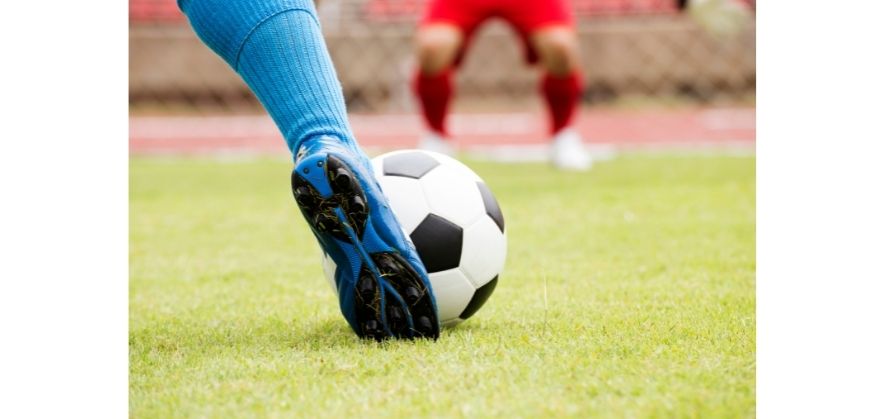 black and white soccer balls - assisted foot placement for players