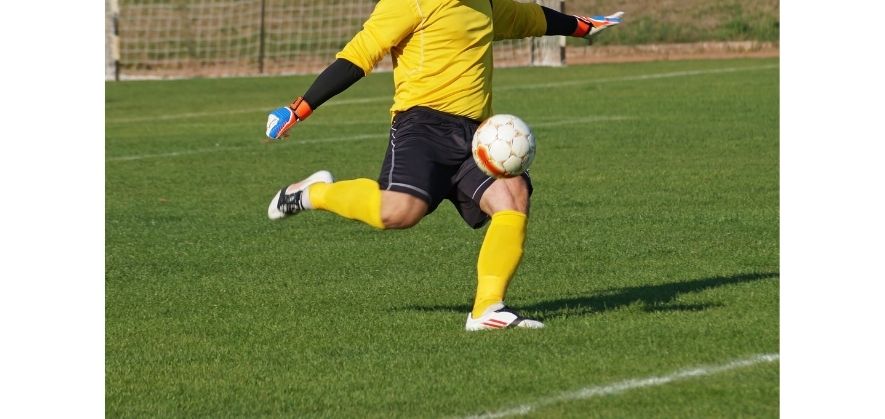 how to punt a soccer ball - plant your weak foot