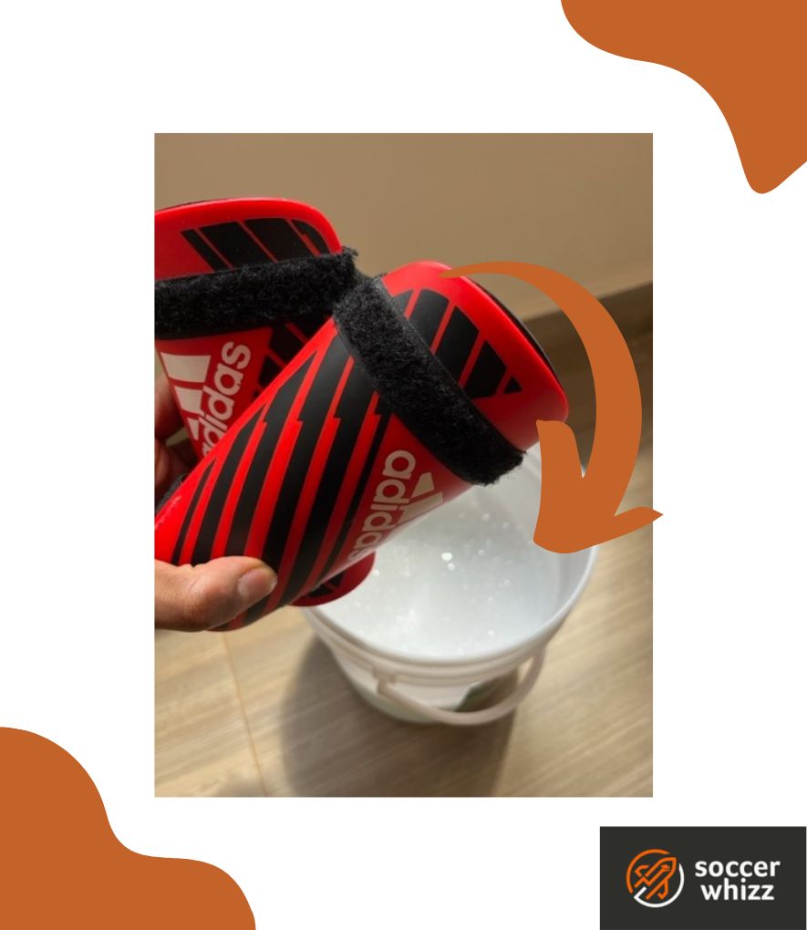 how to clean soccer shin guards - soak them in soapy water solution